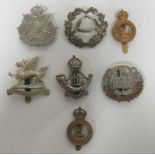 7 Territorial cap badges, including 7th Hampshire Regiment, Northamptonshire Regiment etc. All in