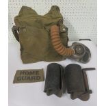 A Home Guard respirator complete with its haversack containing anti gas ointment, dimming outfut and