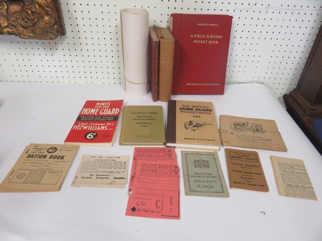 A small quantity of military related books (most reproductions) and ephemera including ration books,