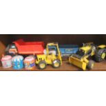 Quantity of unboxed vehicles together with three tin plate musical toys