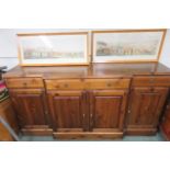 One modern stained pine sideboard with four doors one long and two small drawers the middle