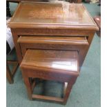 A nest of four oriental tables with carved junk top covered by glass 66 x 50 x 35