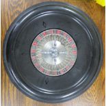 Table top portable roulette wheel with a ball