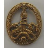 The Ant Partisan badge, with scooped back with three holes and a wide pin and is made in a gold