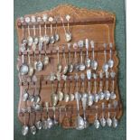 Quantity of collectors spoons in a display cabinet