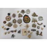 Eleven military cap badges, all complete with lugs or sliders include Dutch made by Gaunt World