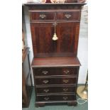 One Mahogany writing bureau with four drawers to lower section, flap down lid containing