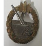 A Coastal Defence War Badge, marked Schwerin, Berlin, and the hinge with flat pin with hook which