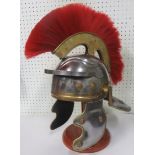 A reproduction Roman Centurions Helmet complete with red crest and fitted liner