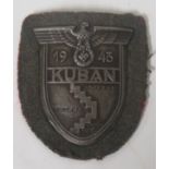 A Kuban arm shield on army backing cloth, the paper backing is missing showing the retaining