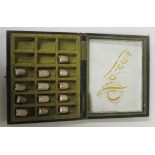 Collection of thirteen hallmarked silver timbles, gross weight 1.48ozt, contained in a case for