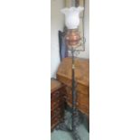 Cast metal standard lamp with shade, 181cm high