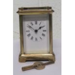 20th century brass gilt carriage clock, with Roman Numeral dial, makers mark indistinct, 11cm high