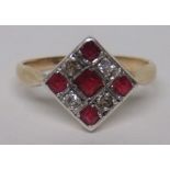 An art deco unmarked gold, platinum (both tested) diamond and ruby geometric panel ring, with five
