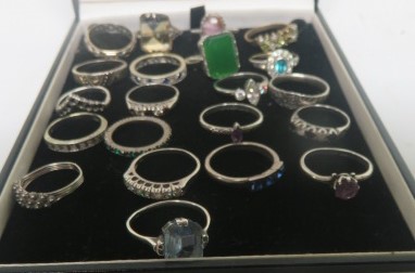 A collection of twenty-one white metal dress rings, to include a marked 9ct white gold diamond