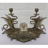 Brass desk stand with a pair of Pheonix each supporting a single candleabra, with ink well to the