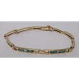 A marked 750 gold, diamond and green stone bracelet, the length approximately 18cm, weight 9.3g
