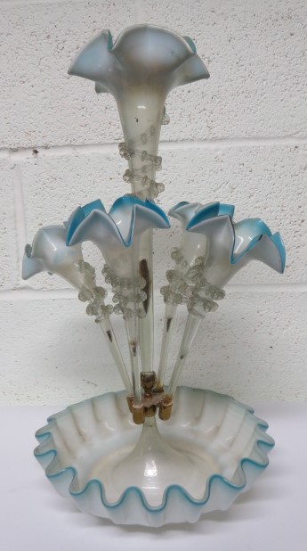 A Victorian blue glass epergne, with central trumpet, with a spiralled band, and four smaller