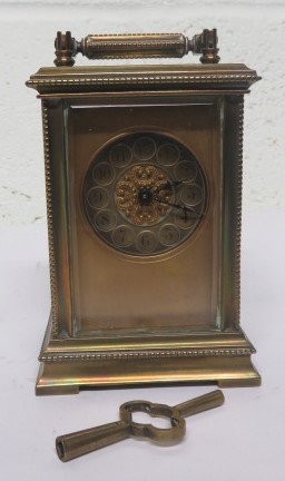 20th century gilt brass carriage clock with chapter ring and Arabic numerical dial