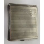 Silver cigarette case with engine turned design and initials to the front, hallmarked for