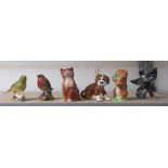 Beswick ginger cat, together with a Beatrix Potter figurine, Squirrel Nutkin, and three bird
