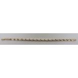 A marked 585 gold bracelet with fancy white gold decoration, the length approximately 18cm,