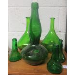 Collection of five green glass bottles