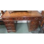 Mahogany veneered twin pedestal desk with tooled leather insert top