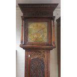 Carved oak longcase clock, with brass face with date aperture and Roman Numeral dial, with