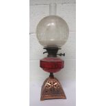 Victorian copper oil lamp, with cranberry glass reservoir together with chimney and an etched