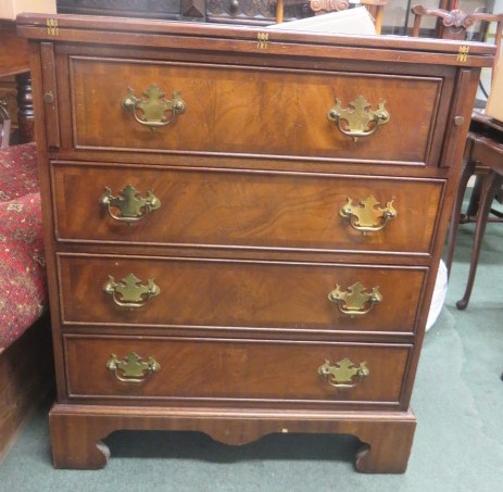 Reproduction chest of four drawers on bracket feet, with fold down top with tooled leather insert