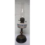 Victorian brass oil lamp, the reservoir with a ceramic classical scene, with chimney but lacking