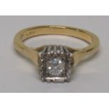 A marked 18ct gold and Plat solitaire diamond ring, the round cut diamond measuring approximately