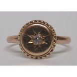 An early 20th century unmarked rose gold (tested) diamond star set ring, ring size N, weight 1.8g