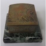Brass box, possibly for stamps, the top decorated with two figures and with contemplation to the