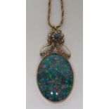 An oval doublet opal and seed pearl pendant piece on an unmarked gold (tested) surround, and