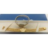 A boxed Tissot ladies stainless steel backed water resistant wristwatch with a gold tone strap,