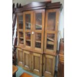 Mahogany veneered breakfront bookcase of architectural form, 217cm x 160cm x 40cm