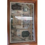 Framed golfing set containing miniature clubs, an 18th tee, miniature hickory golf clubs etc