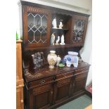 Oak sideboard the top with two shelves flanked by two astragal glazed doors to the top, 184cm x