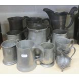 Three pewter jugs, together with a quantity of pewter tankards of various sizes