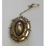 A marked 9ct gold Victorian octagonal tiered brooch, with an un-glassed photograph compartment to