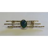 A marked 375 gold triple bar brooch set with an opal doublet length of brooch 4.5cm, weight 2.8g