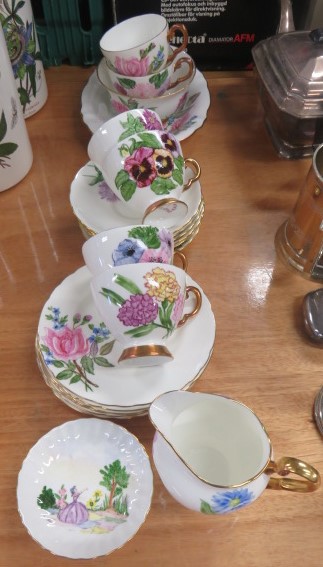 Hand painted part tea service decorated with landscape scene and flowers, painted for the vendor