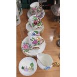 Hand painted part tea service decorated with landscape scene and flowers, painted for the vendor