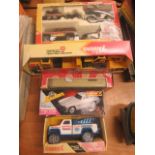 Three BuddyL boxed vehicles to include, a Cross Country Race Set; a Tow Truck; a Lowboy and Scoop--