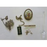 A collection of costume jewellery to include a jade type pendant pieces, a Limoges brooch, gold