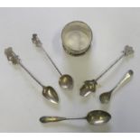 Hallmarked silver napkin ring together with five silver plated tea spoons