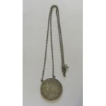 A silver crown dated for 1899 on a white metal chain necklace