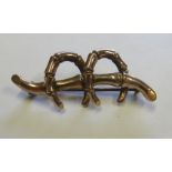 A marked 9ct gold double lucky horseshoe brooch, the length 4.1cm, weight (to include metal pin) 2.